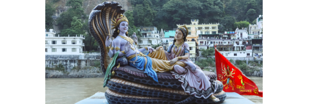 Lord Vishnu and Goddess Lakshmi statue near river on Pausa Putrada Ekadashi festival