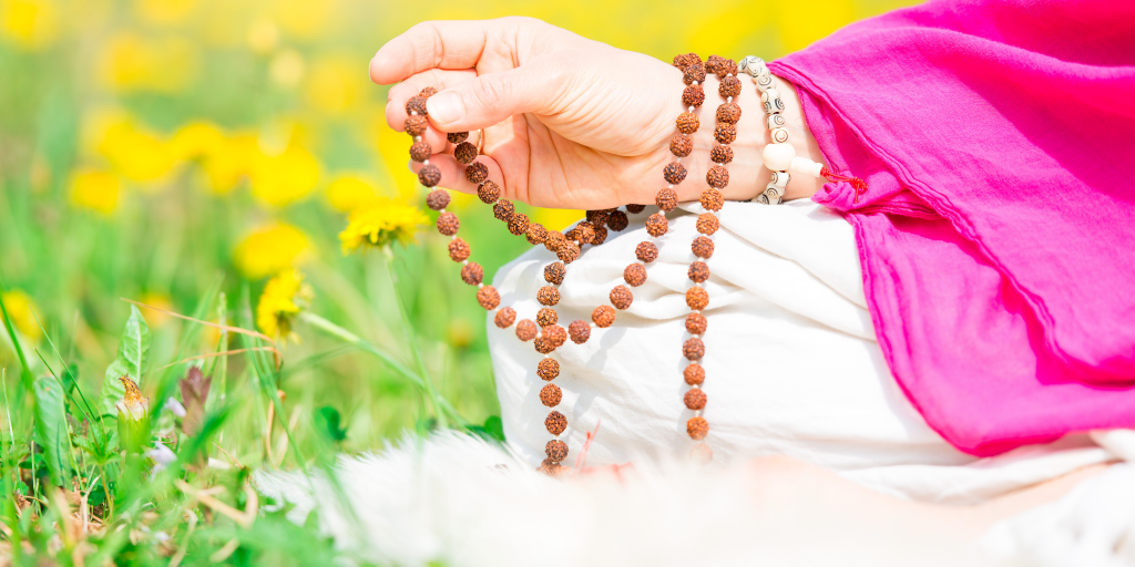 Rudraksha mala in hand while chanting Diwali prosperity mantras